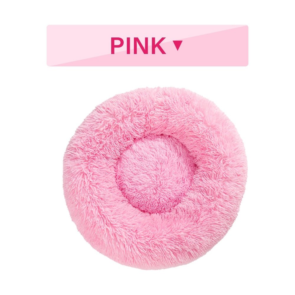 Fluffy donut pet bed with small dog sleeping peacefully