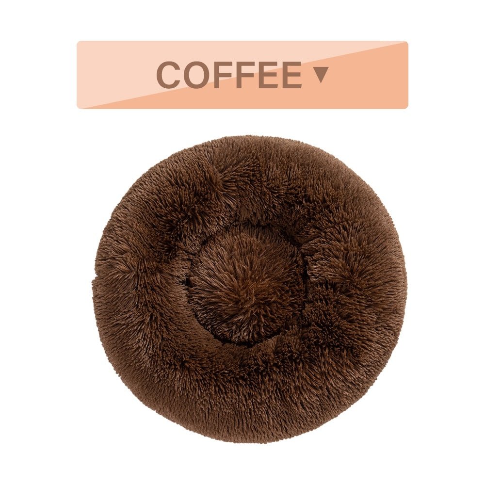 Fluffy donut pet bed showing raised rim and plush texture